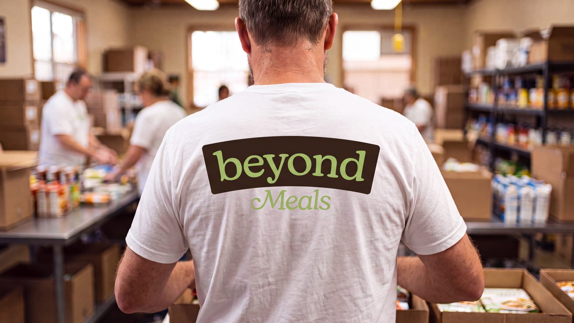 A Beyond Meals volunteer packing the week's boxes