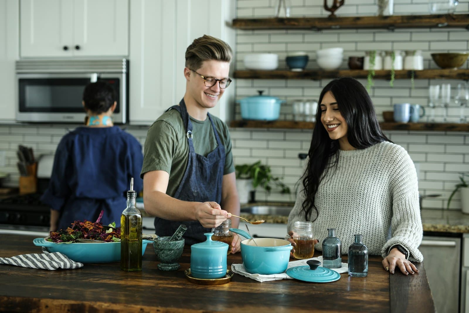 Cooks preparing meals together in a bright kitchen